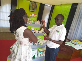  Laboratory Technician, Mr.  Frank Mhini, elaborating to a customer on the rational use of Medicine when she visited the TMDAs booth during the 14th East Africa Trade Fair exhibitions that took place from  30th August to 8th September,2019, in Mwanza.